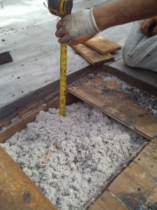 Typical cellulose insulation in a flat roof cavity of a Multi-Family Building. 
